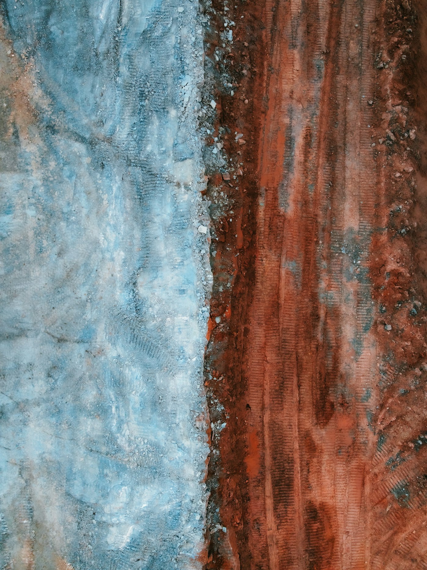 Layered rock and soil strata exposed in a fresh excavation face